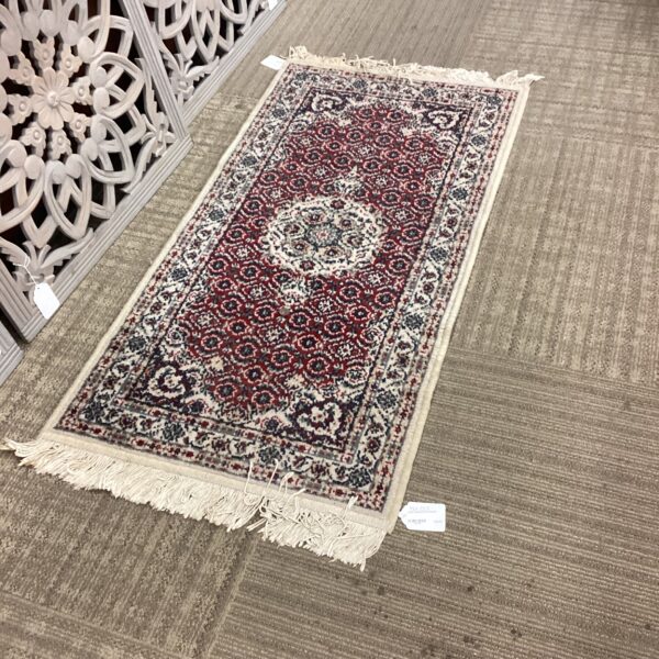 small traditional red rug