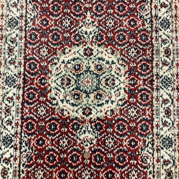 small traditional red rug