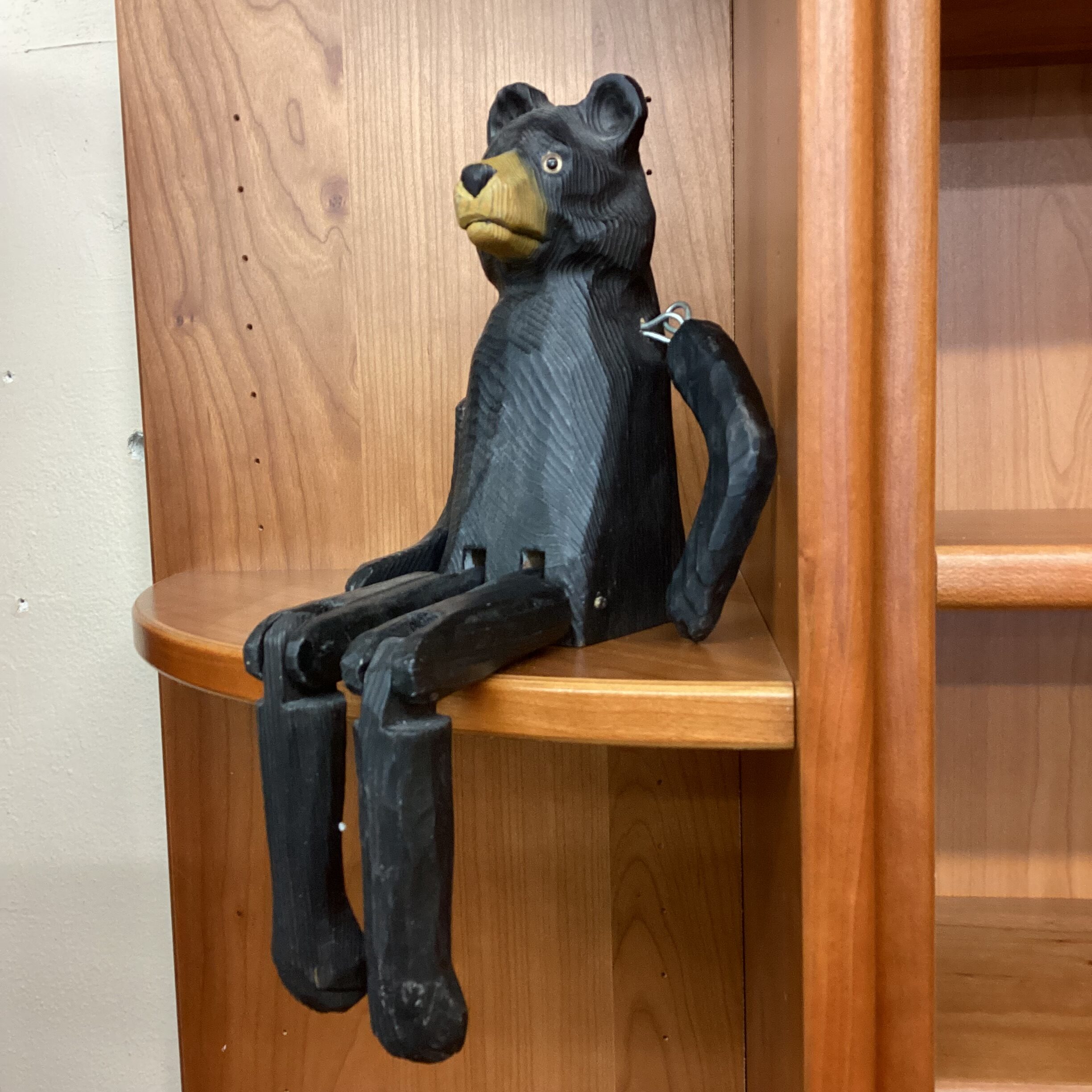 carved wood articulated sitting bear