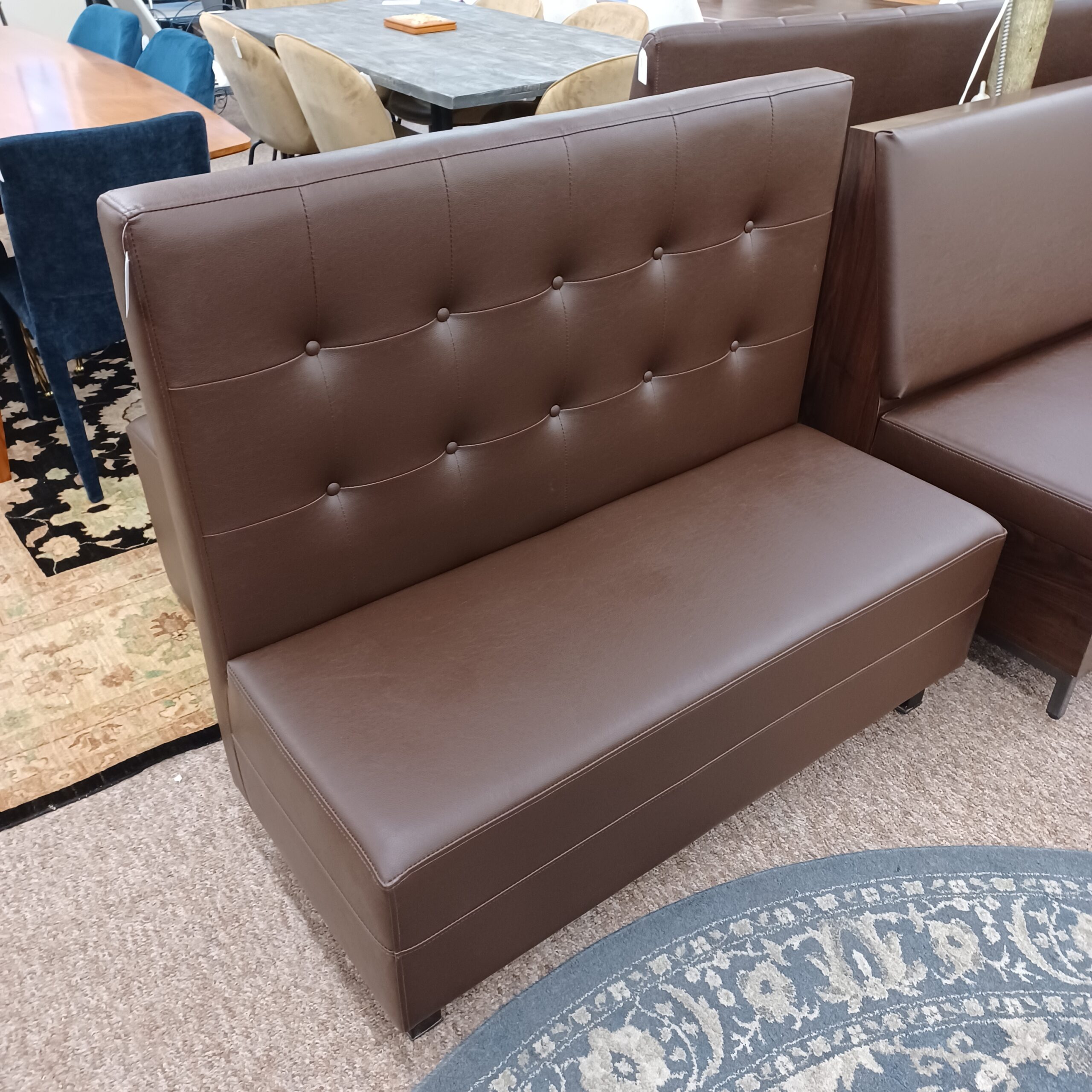 high back brown button tufted booth settee