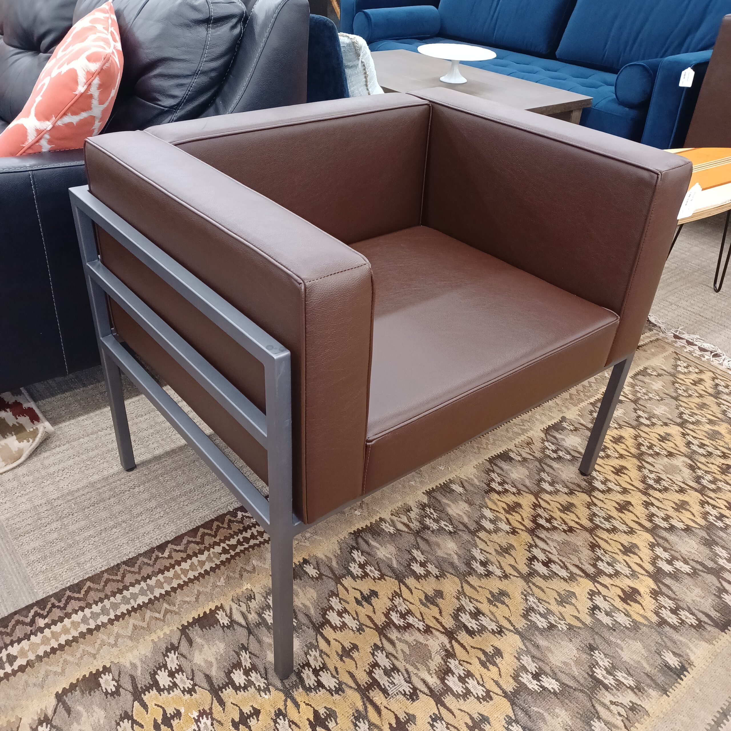 wide gun metal frame brown armchair