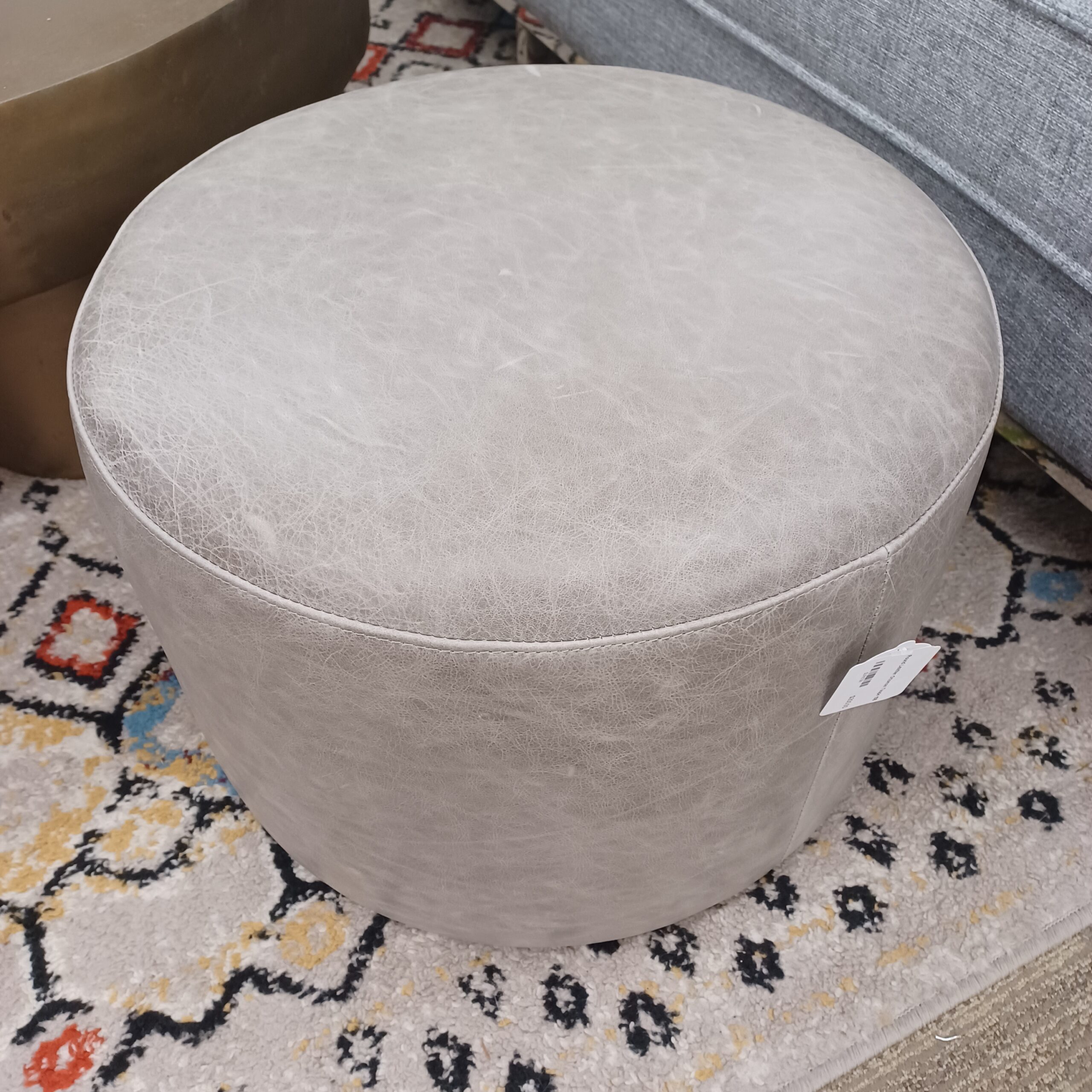 round leather ottoman taupe