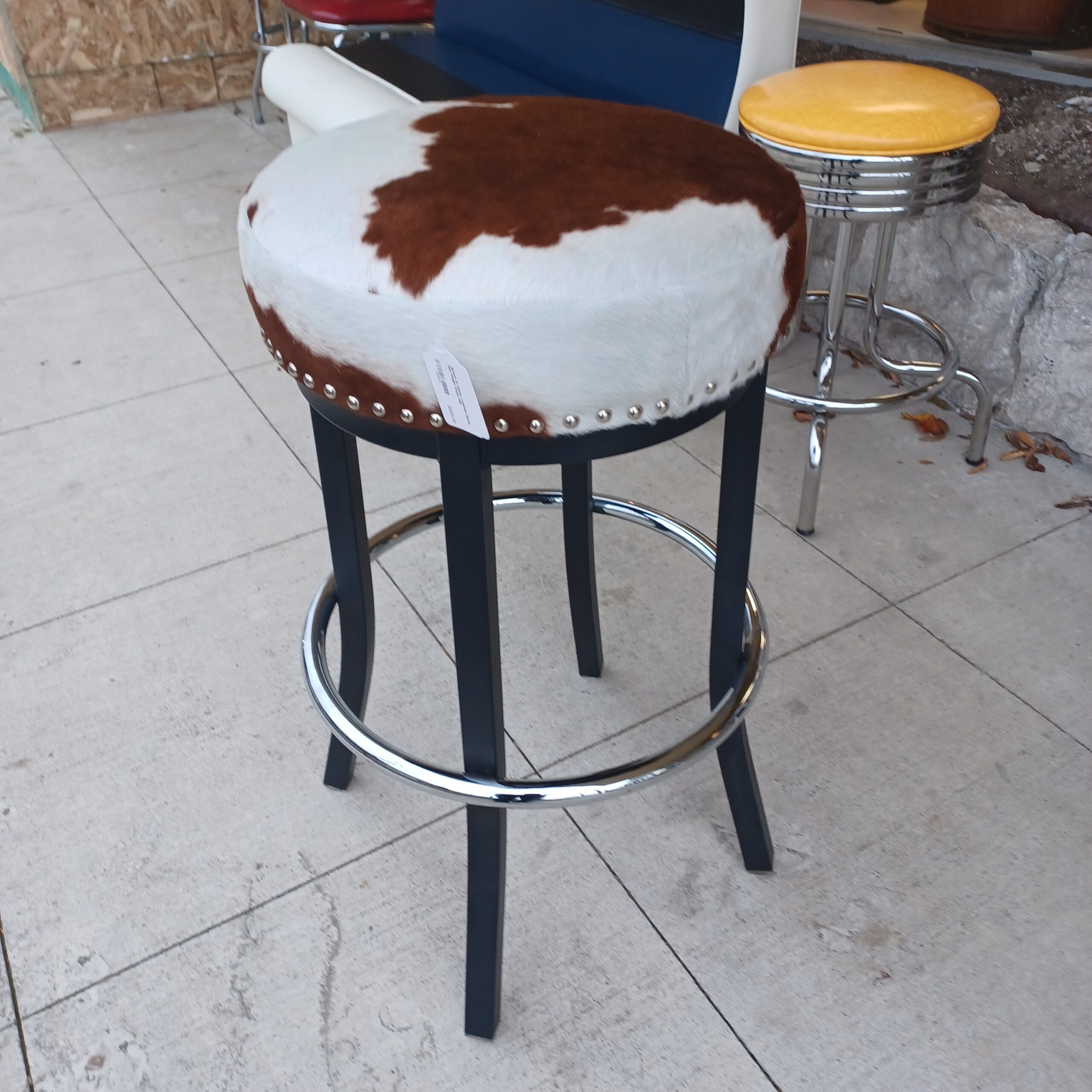 brown & white cowhide metal bar height stool