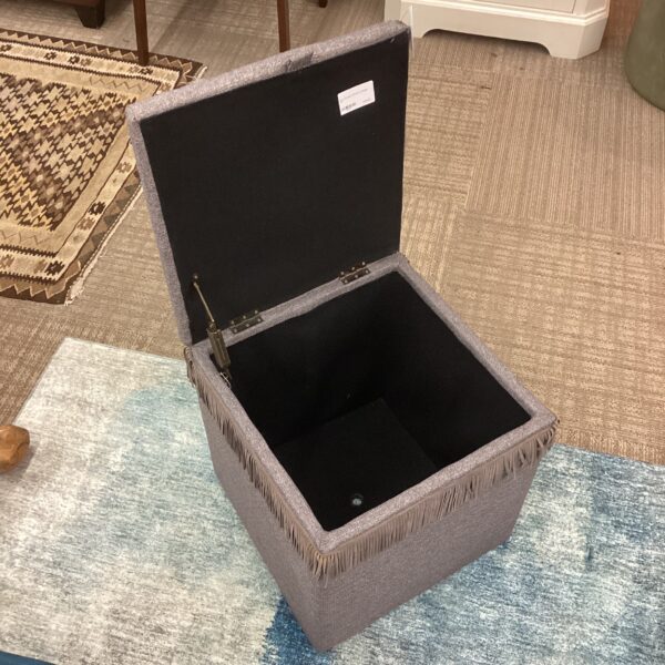 grey storage ottoman w/fringe