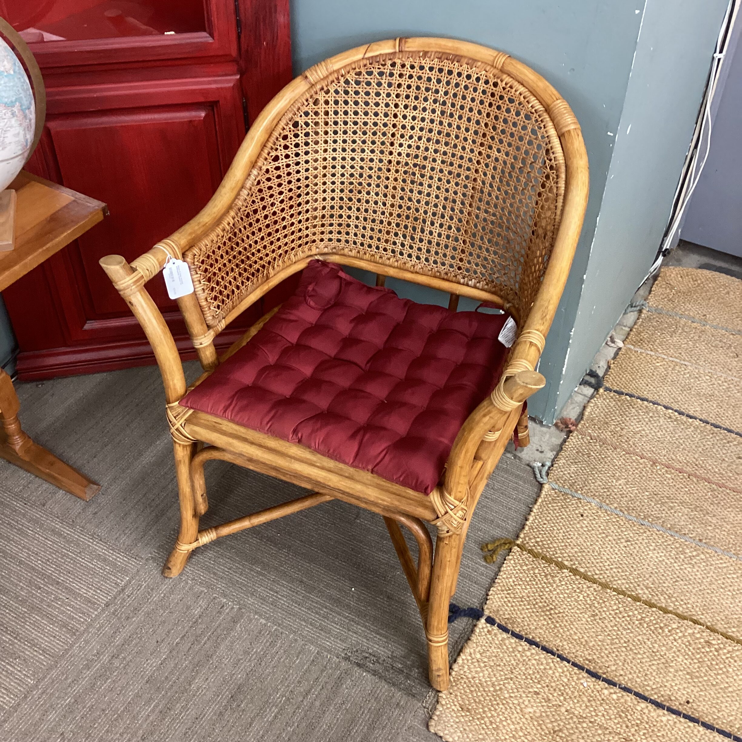 rattan & cane armchair w/burgundy cushion