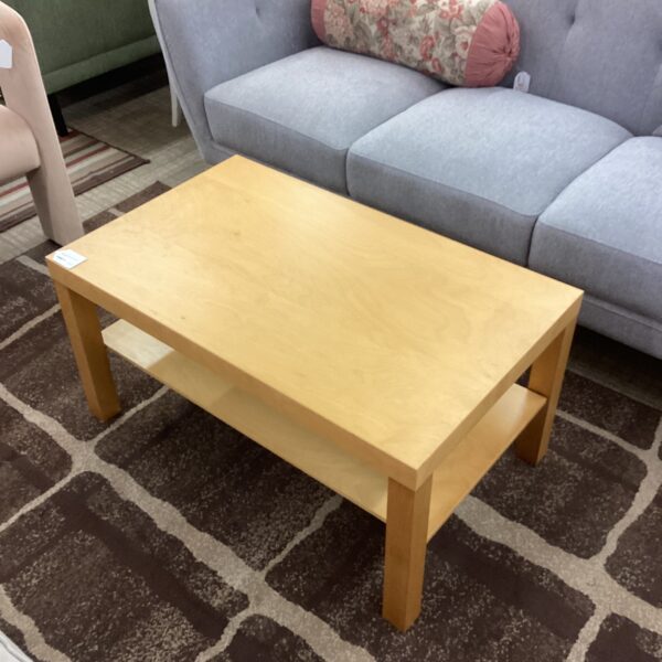 blonde rectangular coffee table w/shelf