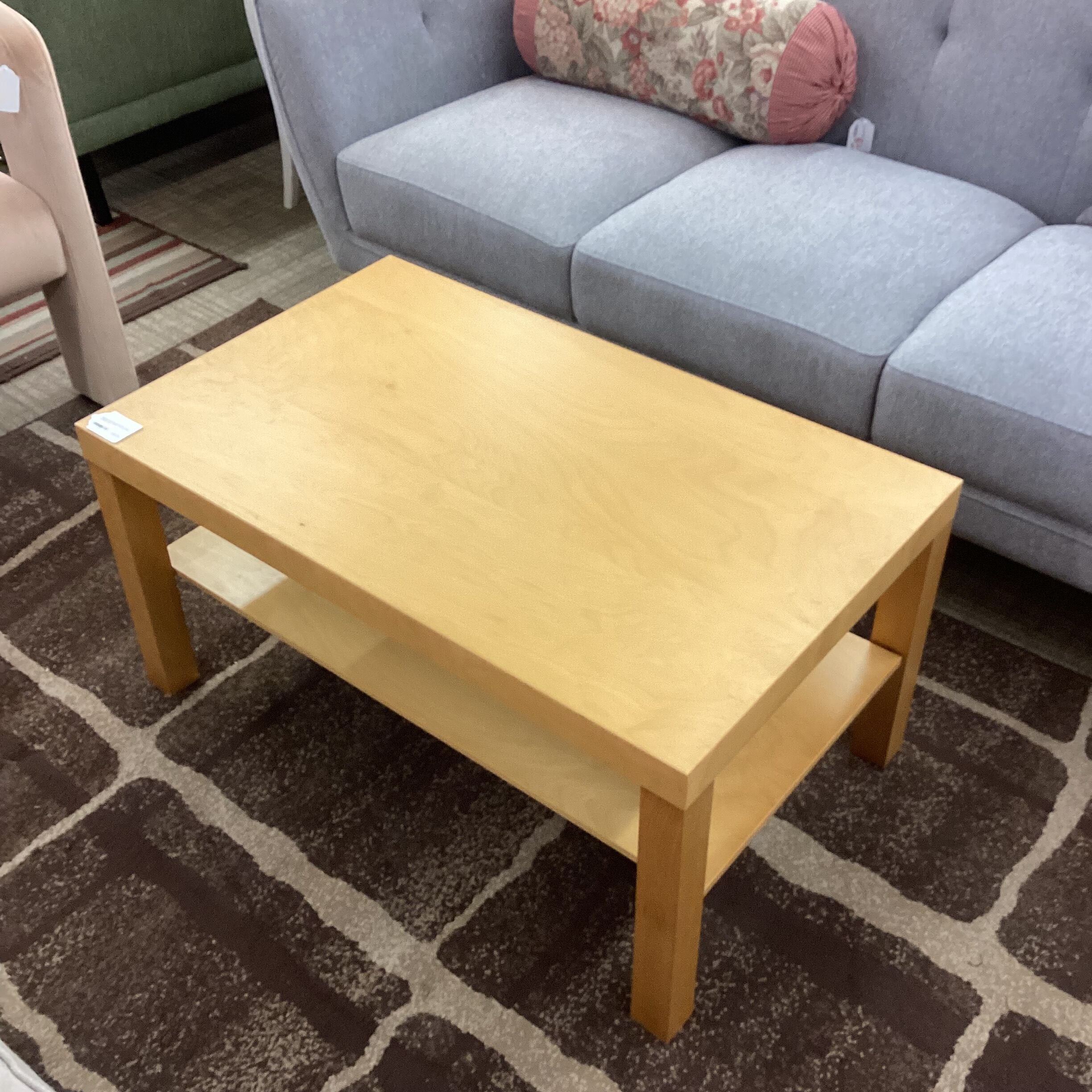 blonde rectangular coffee table w/shelf