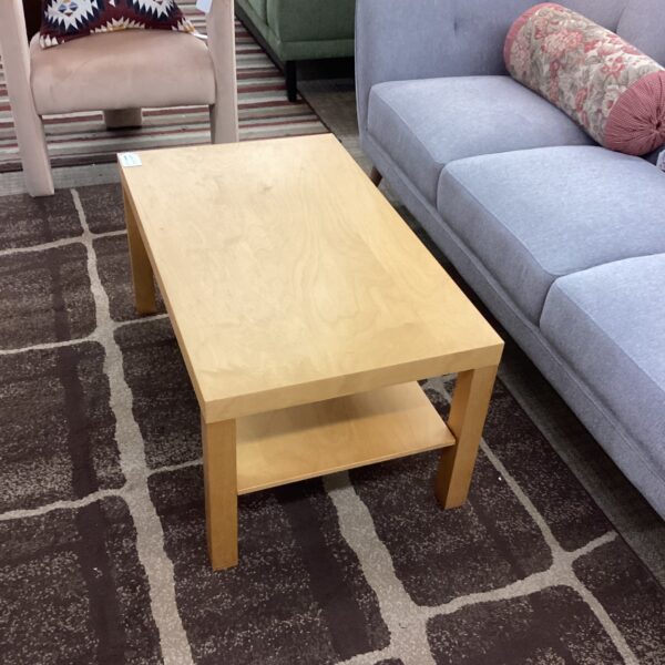 blonde rectangular coffee table w/shelf