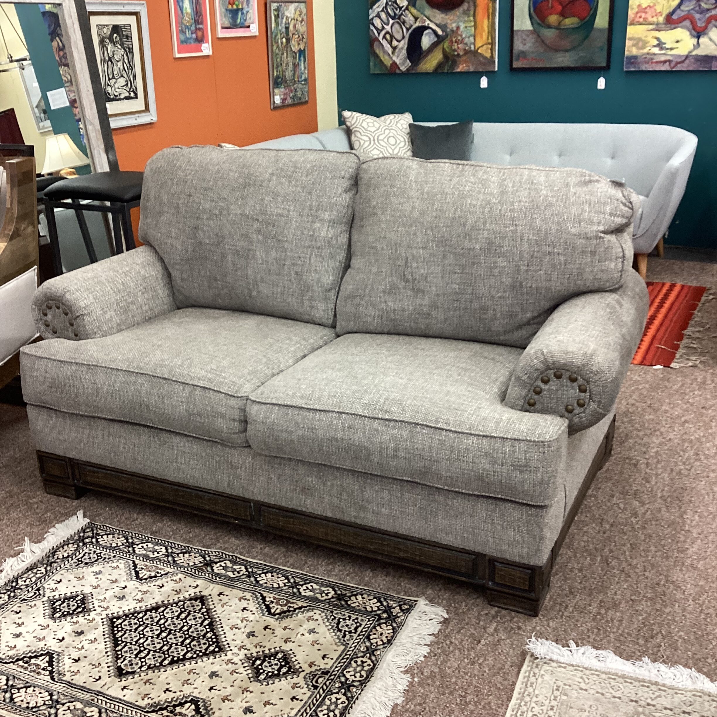 tweed wood base loveseat w/large brass nail head trim