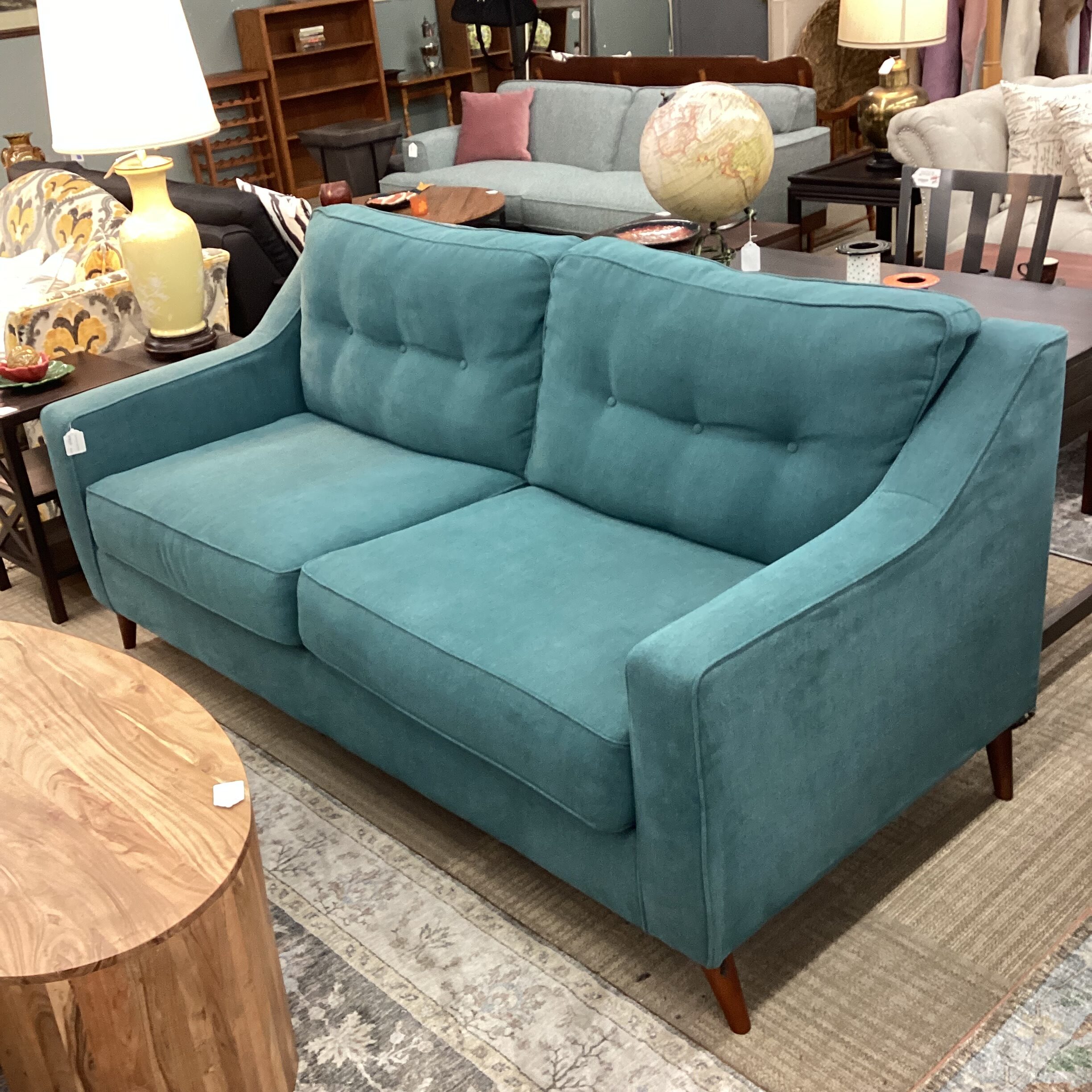 teal button back comfy sofa