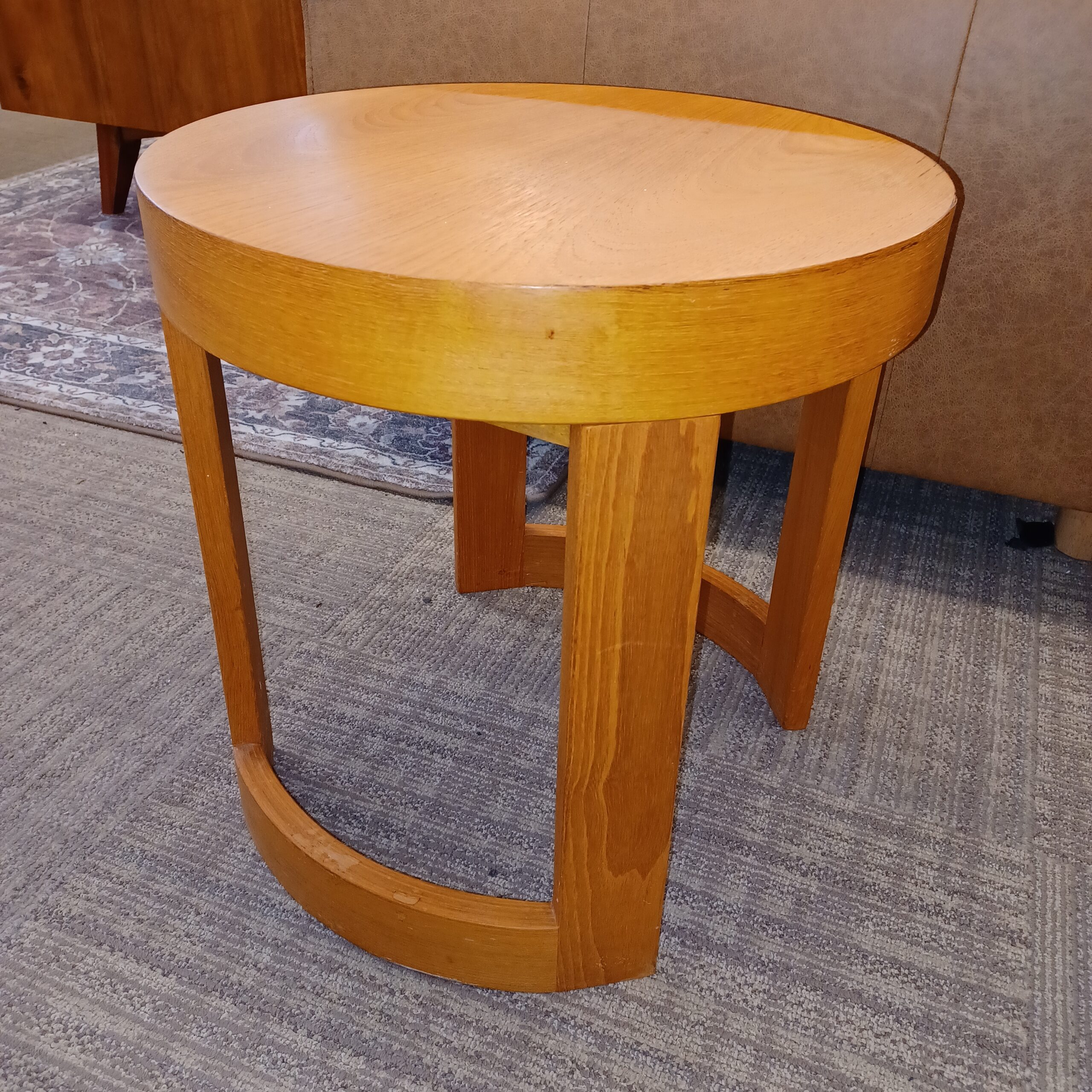 contemporary round blonde hardwood side table