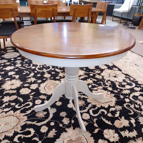 white base round hardwood dining table